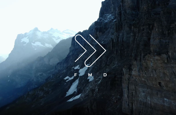 Dramatic shot of mountain scenery and FMD logo